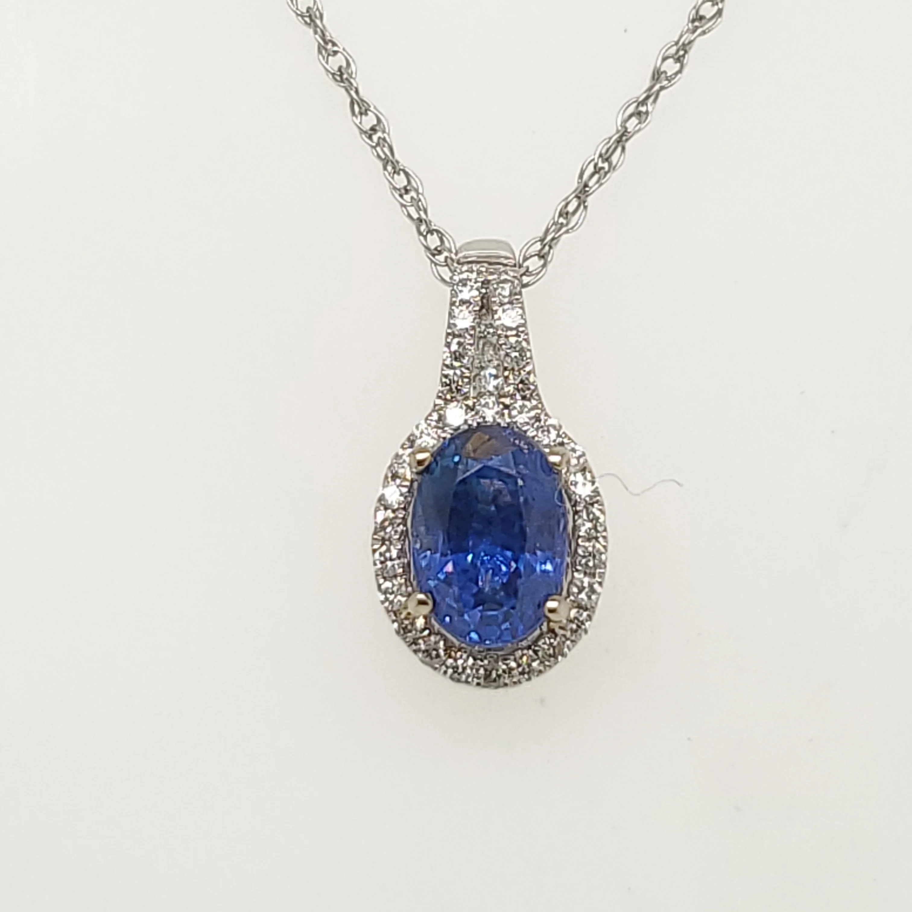14Kt White Gold Sapphire And Diamond Pendant.