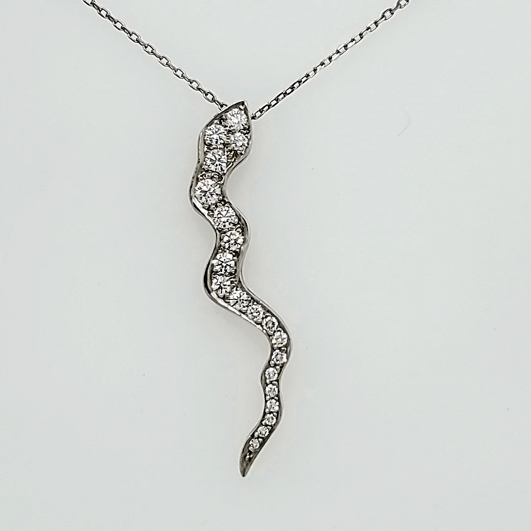 Platinum snake pendant with an estimated one carat of diamonds